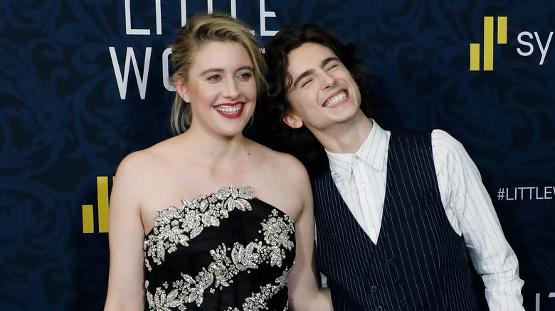 Greta Gerwig smiling with Timothée Chalamet