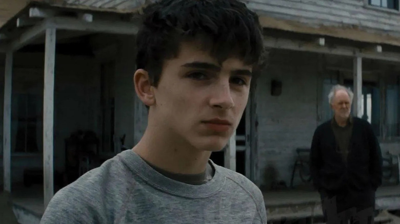 Chalamet in front of house in Interstellar