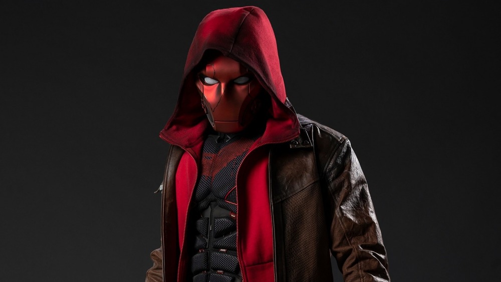 Curran Walters as the Red Hood