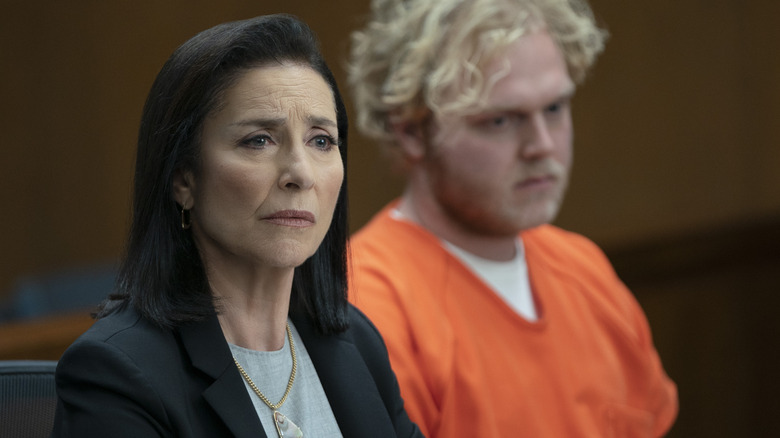Mimi Rogers and an inmate sitting in court