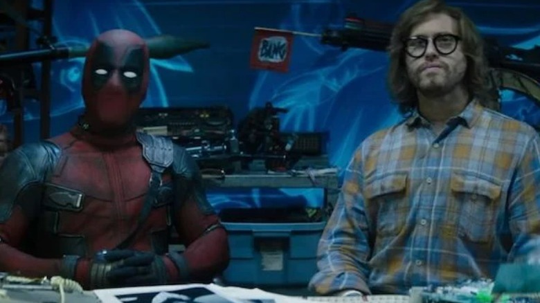 Deadpool and Weasel sitting at a table