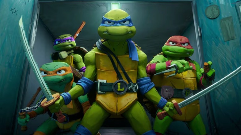 The TMNT holding their weapons