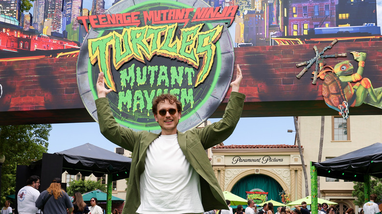 Jeff Rowe in front of TMNT: Mutant Mayhem display