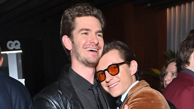 Andrew Garfield and Tom Holland embrace