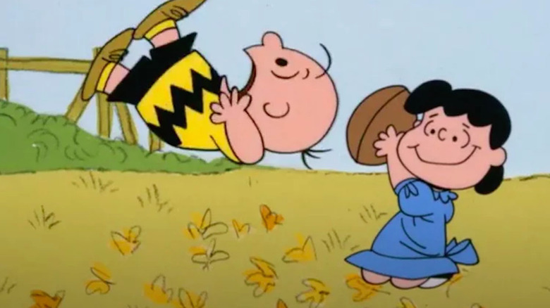 Lucy pulling the football away when Charlie Brown tries to kick it