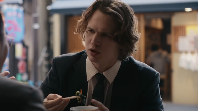 Ansel Elgort as Jake Adelstein eating