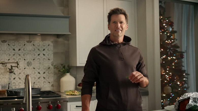 Tom Brady standing in kitchen 