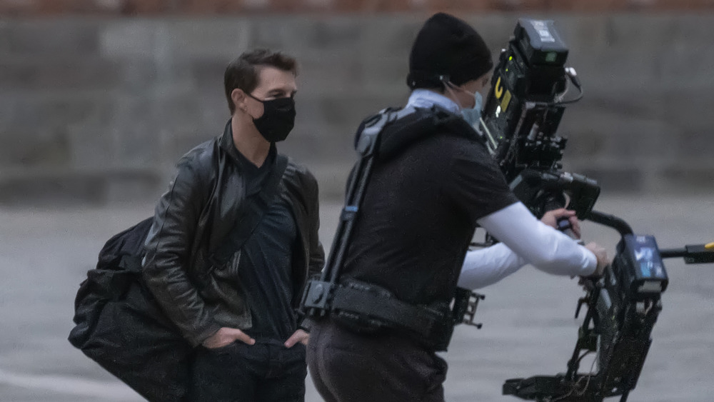 Tom Cruise stands on Mission Impossible set