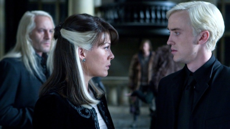 Lucius, Narcissa, and Draco Malfoy indoors