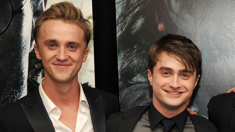 Tom Felton and Daniel Radcliffe smiling