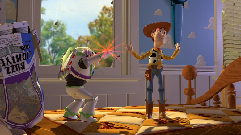 Buzz pointing a laser at Woody