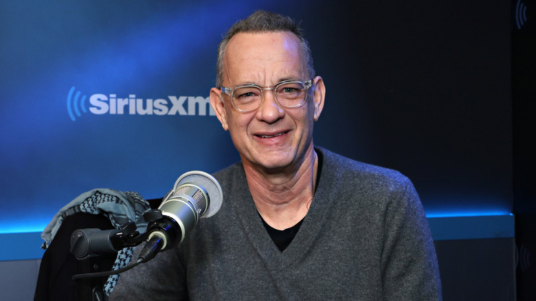 Tom Hanks smiling during an interview