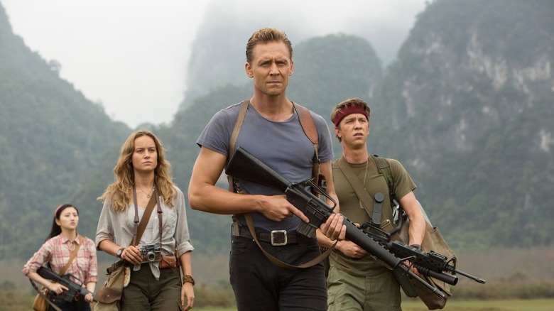 Tom Hiddleston leads a group through Skull Island