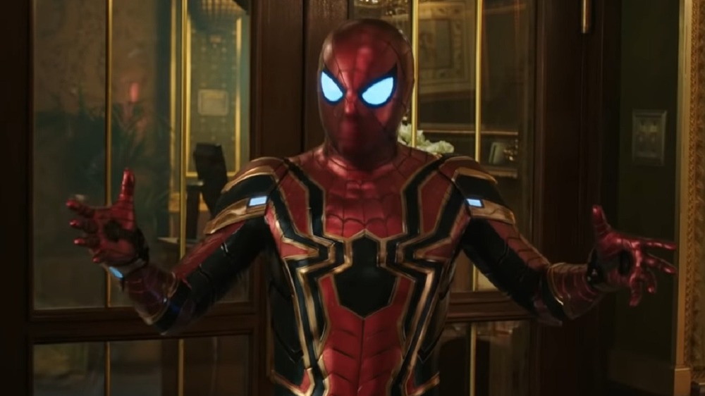 Tom Holland as Spider-Man gestures in the Iron Spider suit