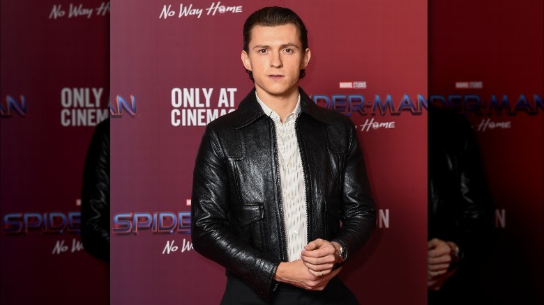 Tom Holland looking seriously at camera 