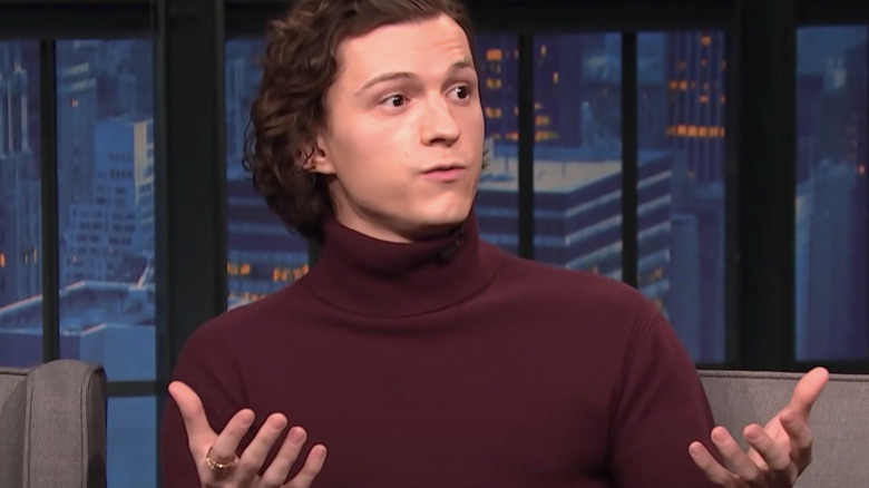 Tom Holland talks expressively to Seth Meyers