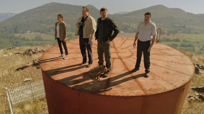 Professionals characters on massive water tower