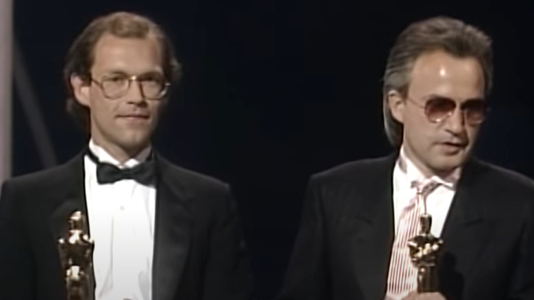 Tom Whitlock and Giorgio Moroder accepting Oscars