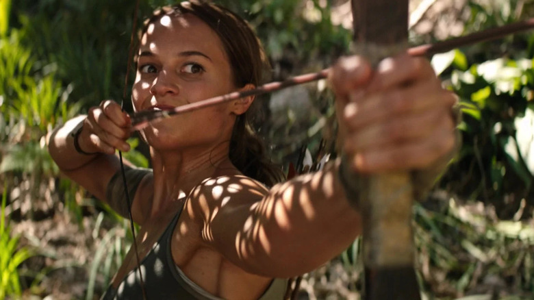 Lara Croft aims an arrow