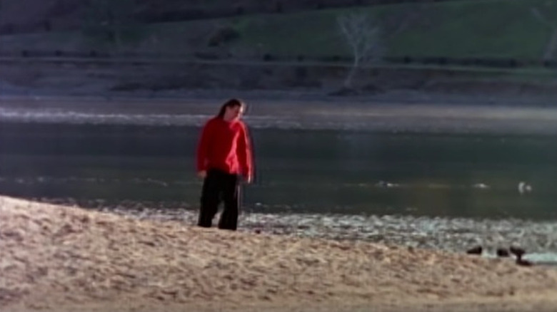 Tommy Oliver walking on beach