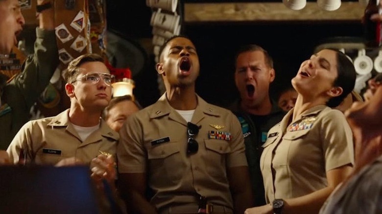 Pilots singing by piano in a bar 