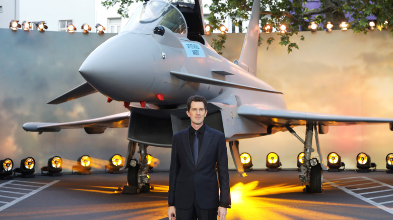 Joseph Kosinski in front a of a plane