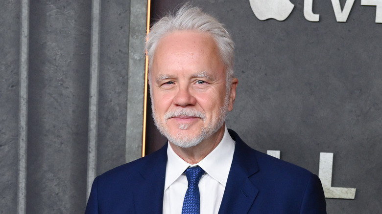 Tim Robbins squinting blue suit