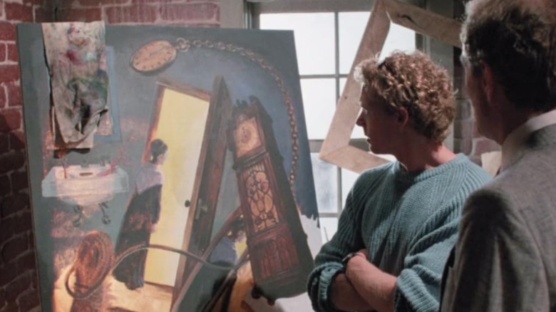 Roger looks at a painting