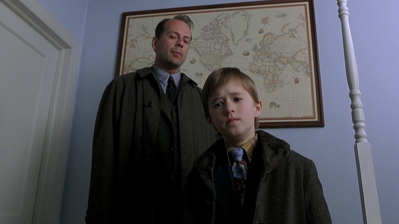 Bruce Willis and Haley Joel Osment serious