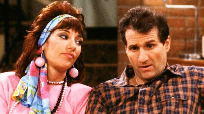 Peggy and Al Bundy sitting