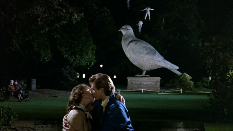 Val Kilmer and Lucy Gutteridge kiss under a pigeon statue in Top Secret!