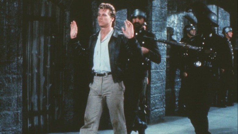 Val Kilmer as Nick Rivers being held at gunpoint in Top Secret!