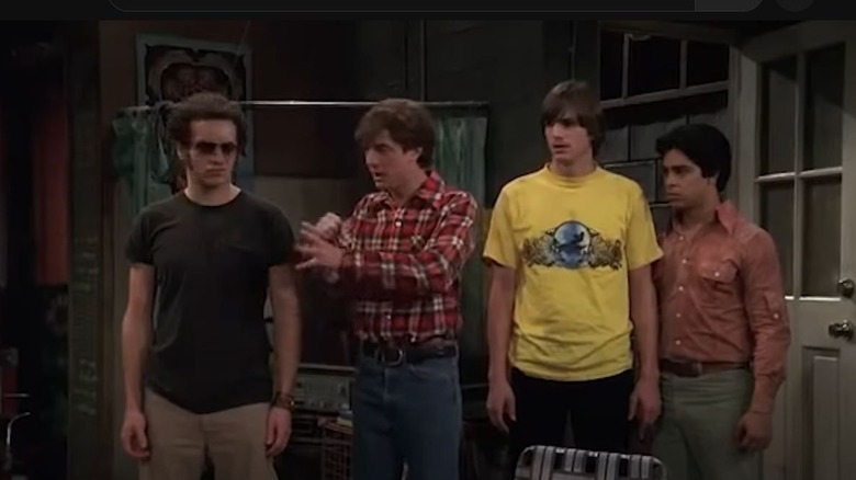 Hyde, Eric, Kelso, and Fez standing