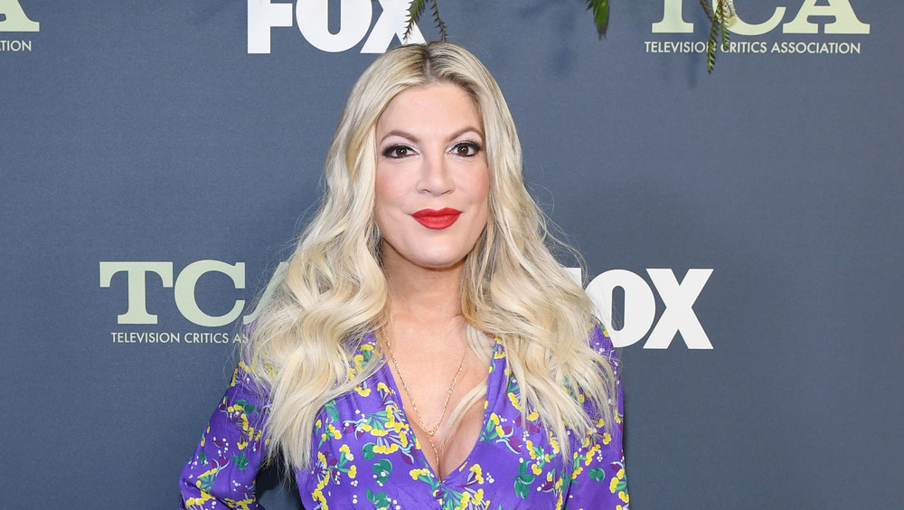 Tori Spelling in colorful dress