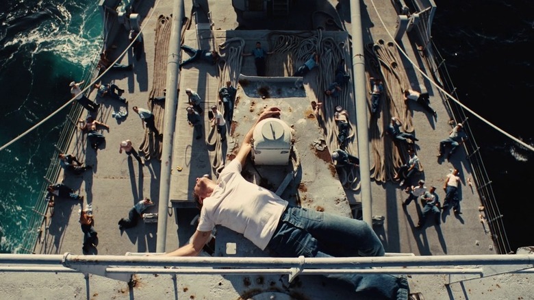 Joaquin Phoenix at top of battleship