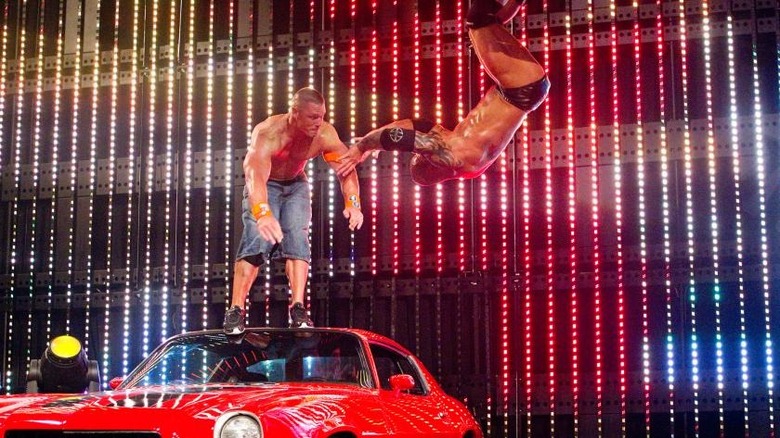 John Cena yeets Batista off a car