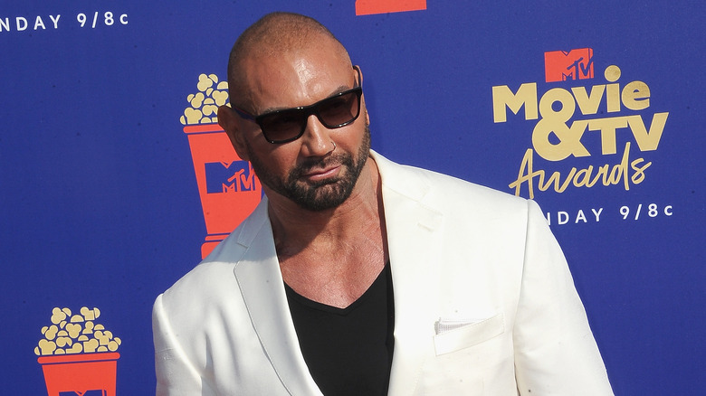 Dave Bautista leans