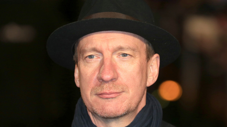 David Thewlis wears a hat