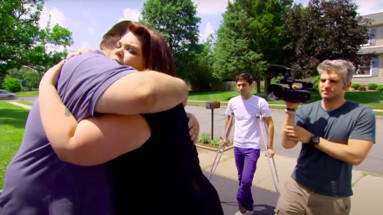 Mike and Ashley embrace as Nev Schulman and Max Joseph watch