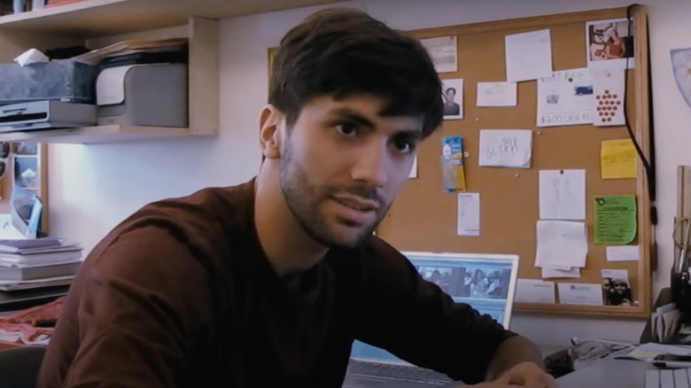 Nev Schulman sitting at his computer in the original Catfish film