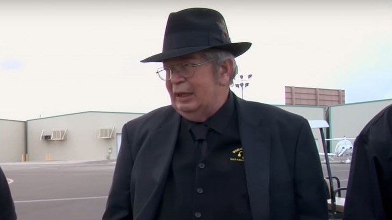 Richard Harrison talking wearing hat