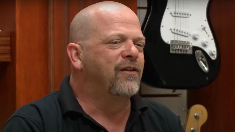 Rick Harrison talking in shop