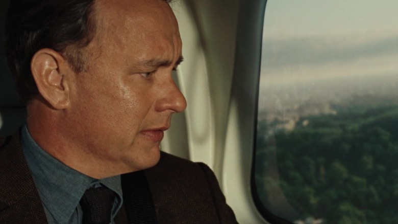 Robert Langdon looking out plane window