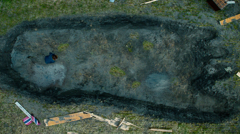 Nora Tidermann standing in giant troll footprint