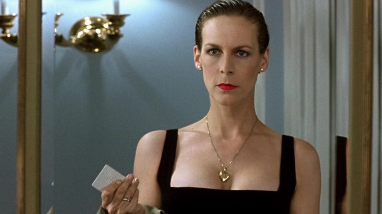 Jamie Lee Curtis looks in a mirror