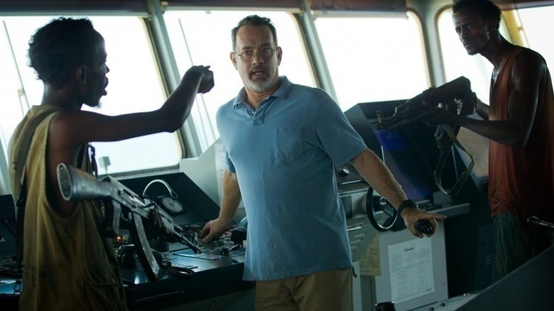 Pirates pointing at Captain Phillips