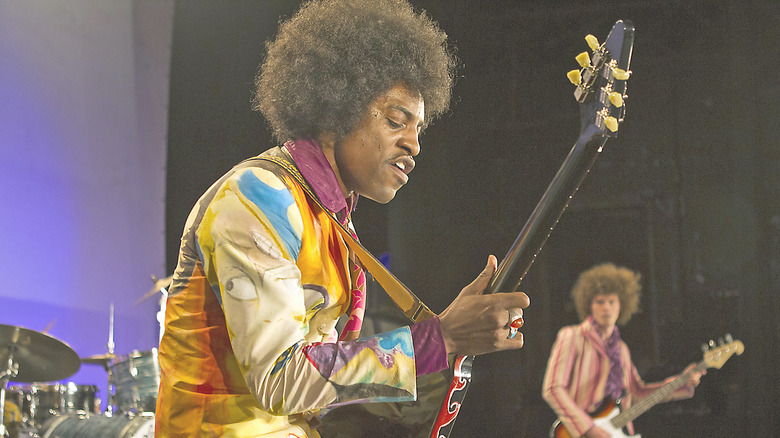 Jimi playing guitar onstage