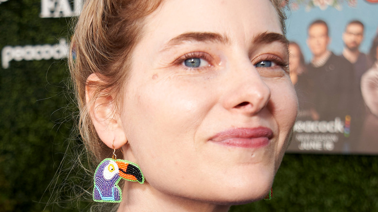 Lisa Hanawalt wearing an earring in the likeness of the character Tuca from Tuca and Bertie