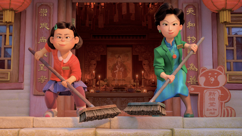 Mei and Ming holding brooms in Turning Red