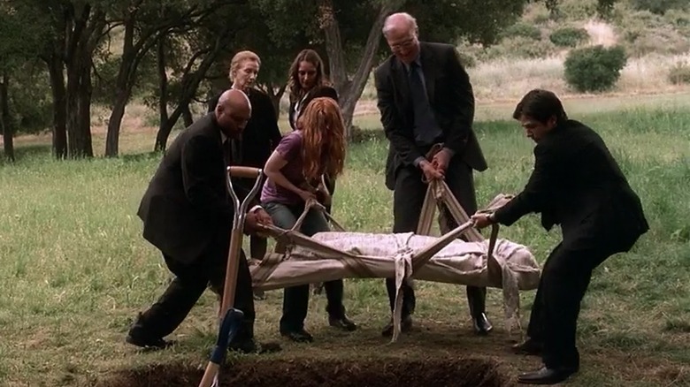 Nate Fisher being buried 